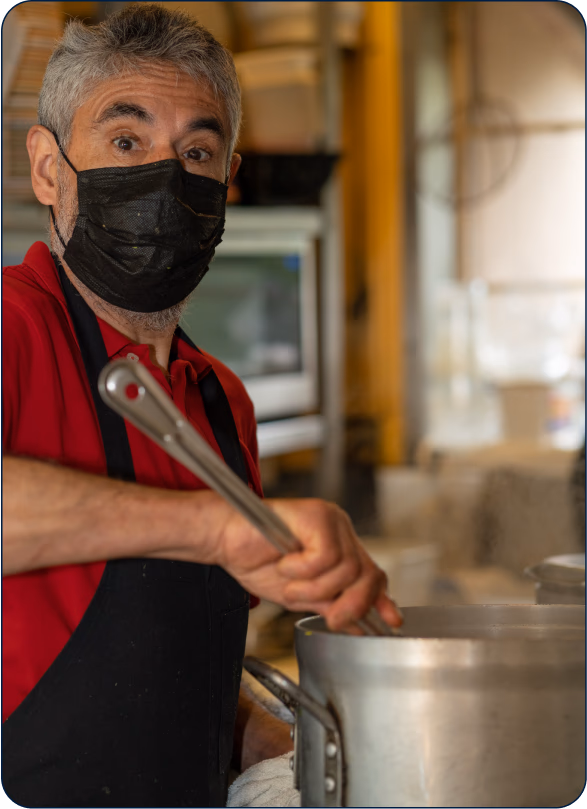 A chef working in a restaurant kitchen